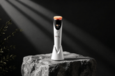 Luxury red light therapy skincare device with modern spa aesthetic