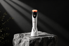 Luxury red light therapy skincare device with modern spa aesthetic